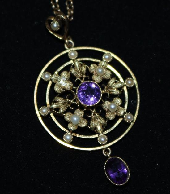 A 15ct Victorian seed pearl and amethyst pendant on a 9ct gold chain, pendant 1.75in.